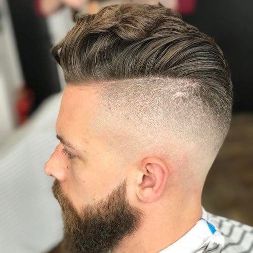 Undercut fade pompadour with long beard