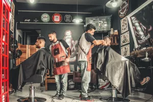 a man cutting a man's hair