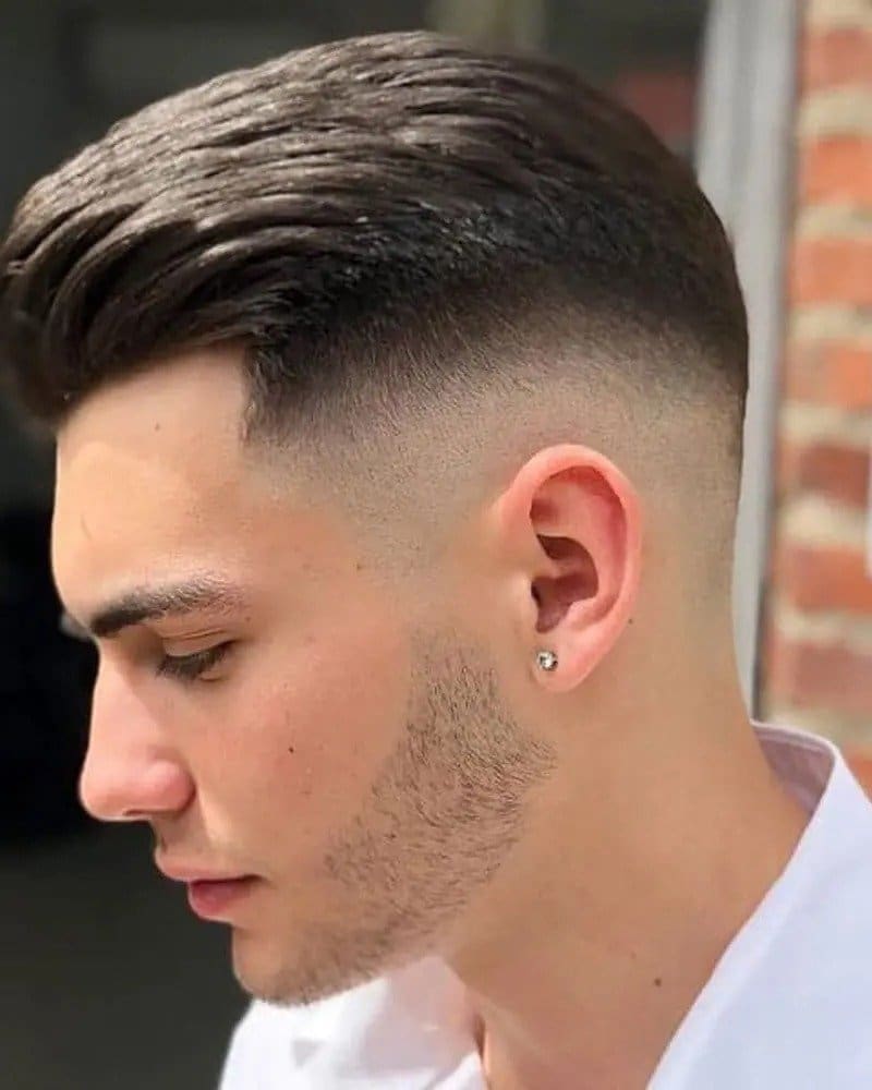 Slicked Back Hair With Medium Fade men haircut